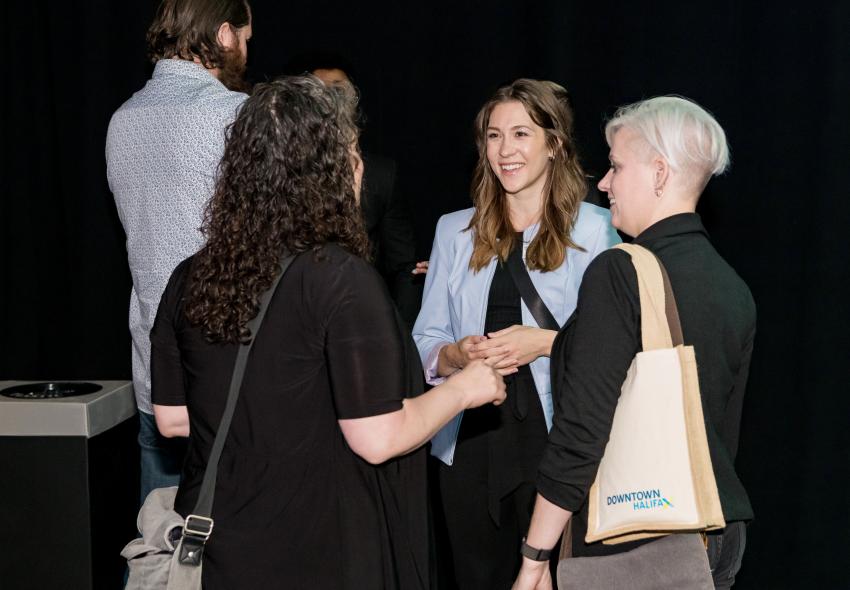3 women having a conversation 