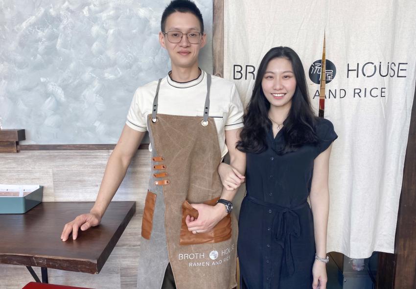 A man and women in a restaurant 