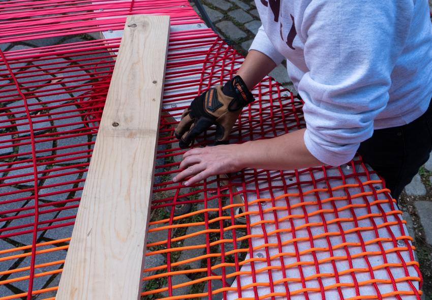 Weaver working on the Blooming Seating