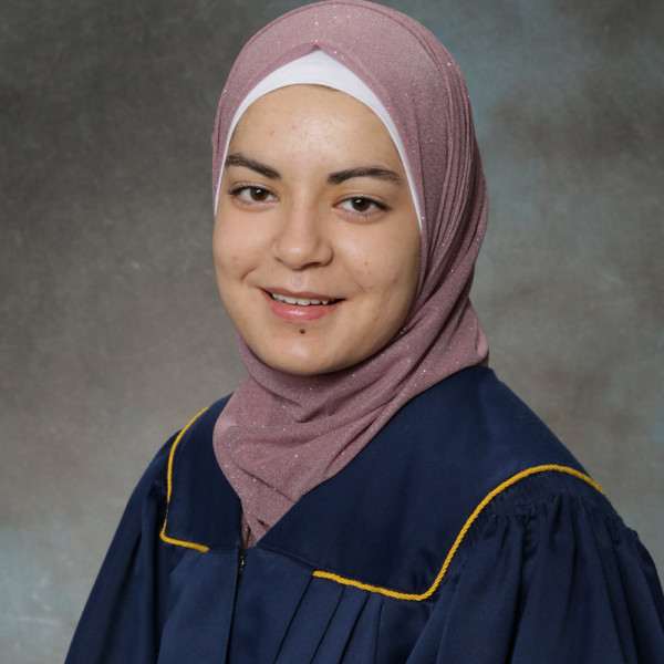 Girl in navy blue graduation gown 