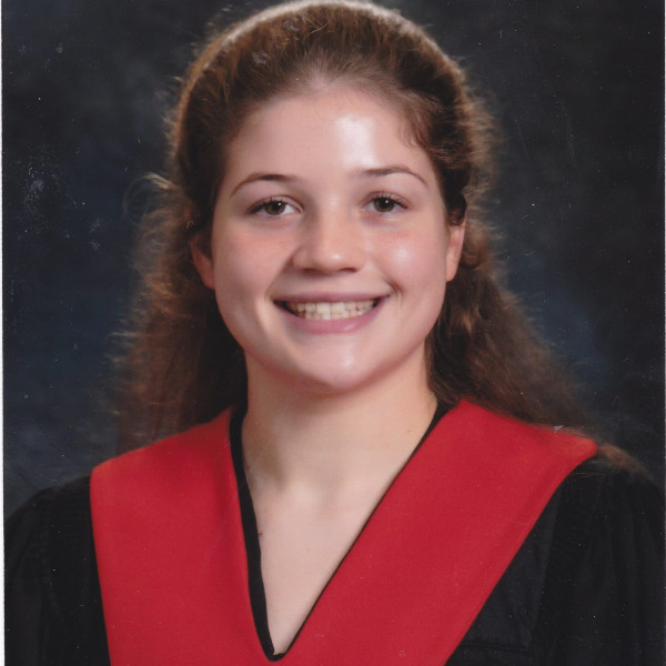 Girl in black graduation gown with red collar